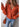 Sweater with large collar in red or orange by the C